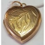 A heart engraved locket in 9ct