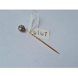 A vintage high carat (unmarked) daimond & pearl stick pin