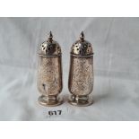 A attractive pair of Victorian engraved crested pepper castors 3 1/2 inches high, London 1849 by