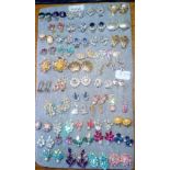 A pad of numerous pairs of stone set & dress earrings