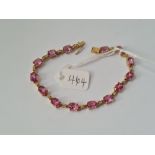 A pink tourmaline & diamond line bracelet set in 9ct