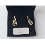 A pair of drop earrings to match above in 9ct