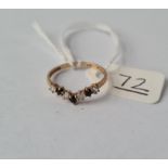 A stone set wish bone ring in 9ct - size K