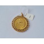 A IRAN 2 1/2 PAHIAVI GOLD COIN IN HEAVY MOUNT