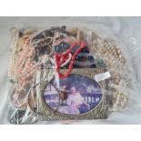 A bag of assorted costume jewellery - 2997gms