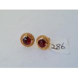 A pair of garnet stud earrings in 9ct