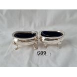 A pair of oval salt pots with blue glass liners, Birmingham 1963 67 gms net
