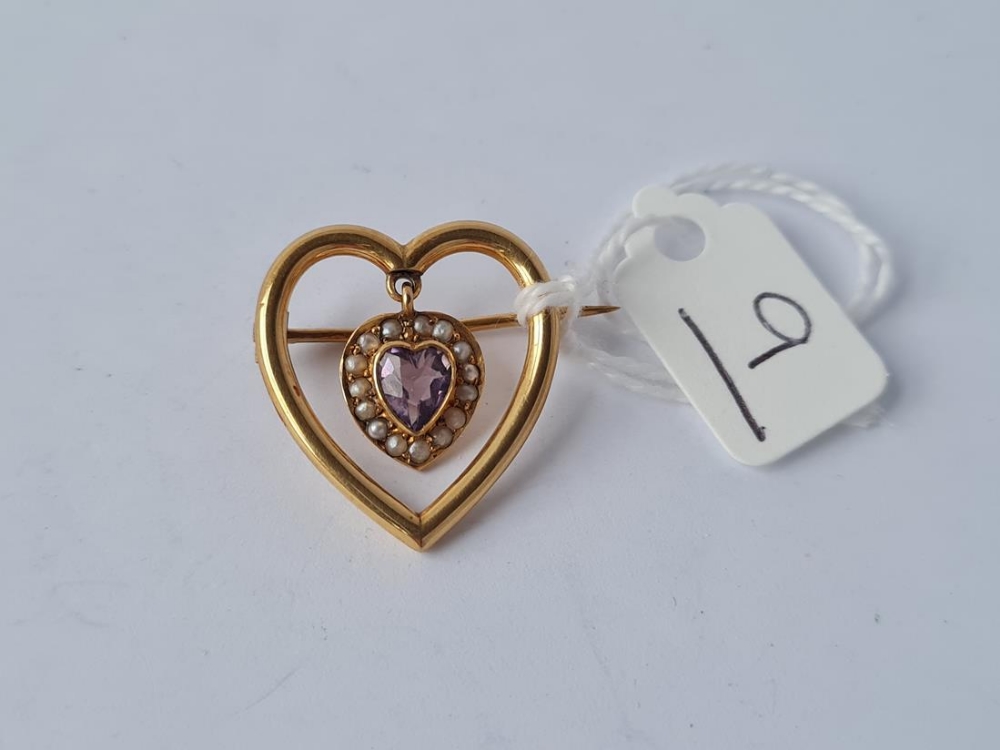 An Edwardian amethyst pearl heart brooch in 9ct