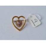 An Edwardian amethyst pearl heart brooch in 9ct