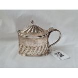 A oval and Victorian half fluted mustard pot with BGL London 1888 by TBJH 66 gms