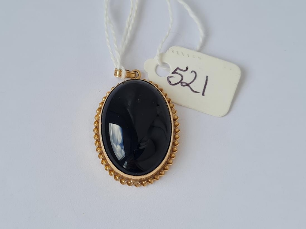A black onyx 9ct mounted pendant