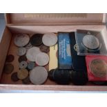 A Tabacco box of coins