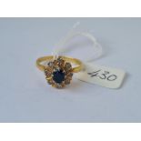 A sapphire & diamond cluster ring in 18ct gold mount size T 6.4g inc