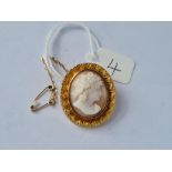 A smaller cameo brooch of a lady set in gold