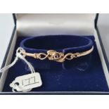 A boxed child's Rennie mackintosh bangle in 9ct