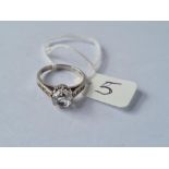 A large stone set ring with stone set shoulders in 9ct - size M - 3.3gms