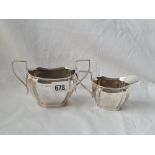 A Shaped oval two handle sugar bowl and matching cream jug 5 1/2 inches wide Sheffield 1929 213 gms