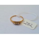 A three stone seed pearl set ring in 14ct gold size P 2.4g