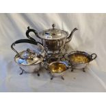 A four piece tea set including kettle on stand