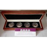 A cased set of four .999 Silver Crowns