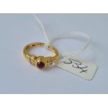 A cabochon ruby ring with diamond shoulders in 18ct gold size I 3g
