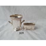 A small two handled wine caller shaped bowl stamped sterling napkin ring 87 gms