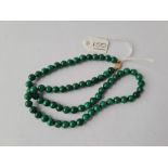 A malacite bead necklace with 9ct clasp