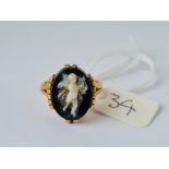 A gold and hardstone cherub ring size L 6.6g inc