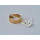 A plain wide wedding band in 9ct size T 5.3g