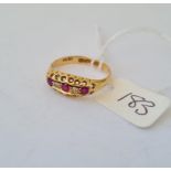 A five stone ruby and diamond 18ct gold ring size Q 2.7g inc