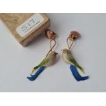 A pair of base metal earrings as birds made with feathers