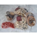 A bag of assorted cotume jewellery including a coral necklace - 1040gms