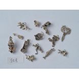 Thirteen stirling silver charms - some articulated - 42gms