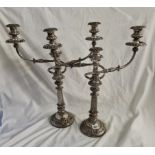 A good pair of old Sheffield three light candelabra with decorated rims 21 inches high