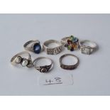 Seven assorted silver gem set rings - 27.3gms