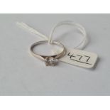 A solitaire white stone ring in 9ct - size N - 1.1gms