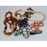A bag of glass bead necklaces, earrings etc