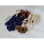 A bag of assorted costume jewellery including a coral twig necklace