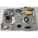 A pad of several good silver brooches including 1 by Ola Gorie