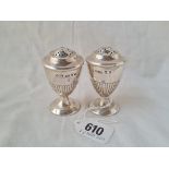 A pair of Victorian Scottish urn shaped pepper pots half fluted 2 1/2 inches high Edinburgh 1886