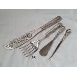 A pair of silver handled Victorian fish servers and a button hook and shoe horn