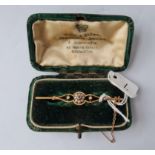 A boxed pearl cluster Victorian bar brooch in 15ct gold