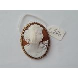 An oval cameo of a lady in a 9ct mount