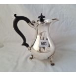 A Chester silver water jug on three pad feet 7 inches high 1916