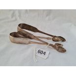 A pair of Exeter fiddle pattern sugar tongs 1810 by I Parkin and another pair 1835 by JS
