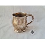 A Christening mug with bulbous body and rim foot 3 inches high Birmingham 1922 79 grms