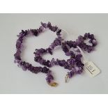 A amethyst & gold clasp necklace in 10ct gold - 34gms - 18" long