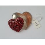 A metal based double heart brooch - 1 heart with red stones