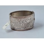 A very wide silver bangle with fern engraving - 39gms