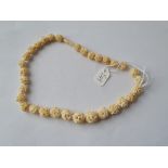 A carved bone necklace